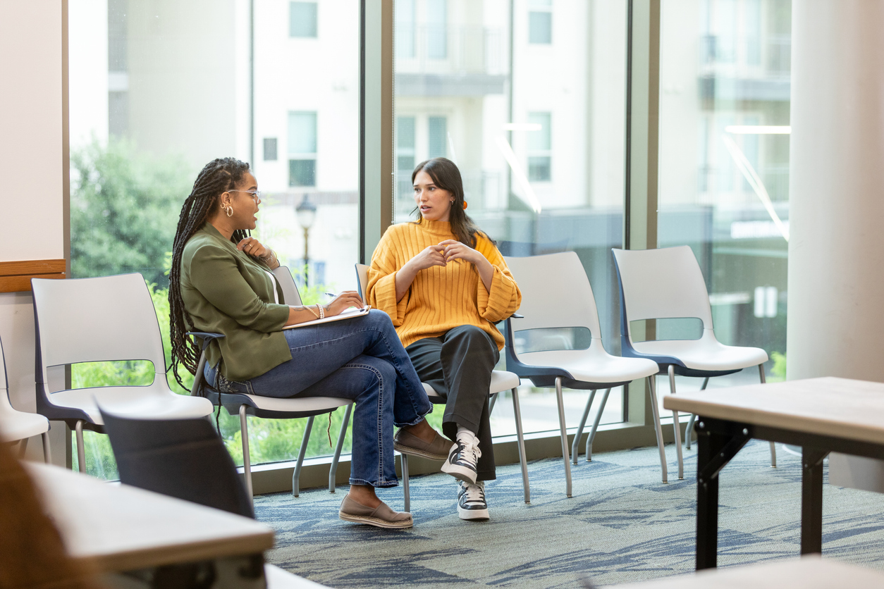 A counselor talks with a client.