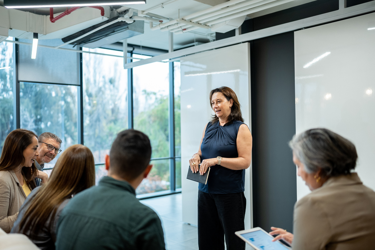 A Chief Financial Officer Leading a Team Meeting.