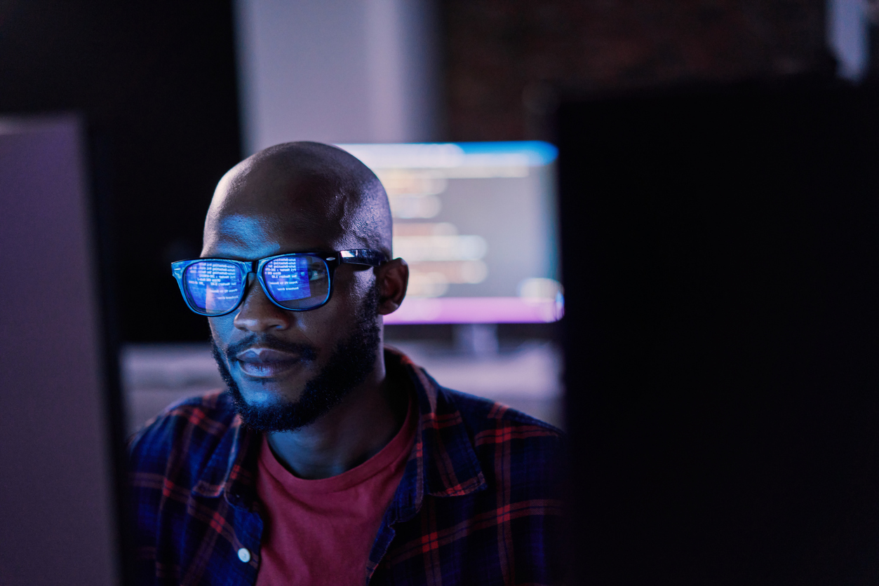 Cybersecurity Professional Looking at a Computer Screen.