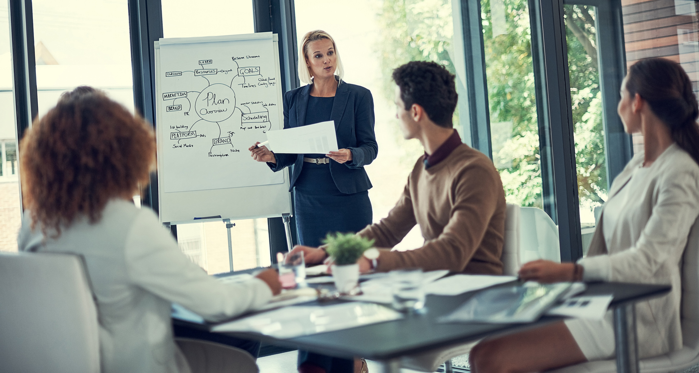 A social media marketing team meets in a conference room.