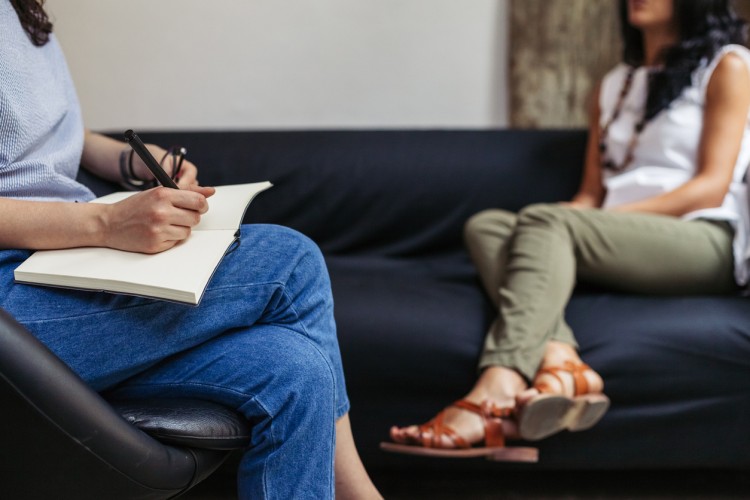 A substance abuse counselor meets with a client.