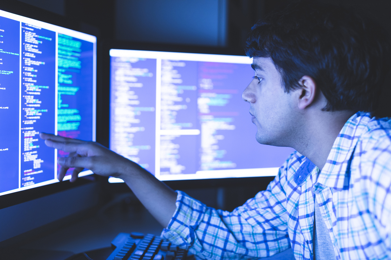 A Cybersecurity Student Studying on Some Monitors..jpg