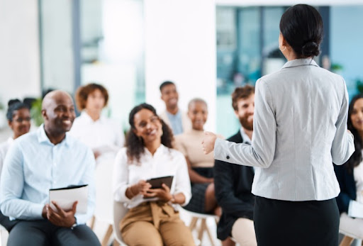 A speaker giving a presentation to an audience. 