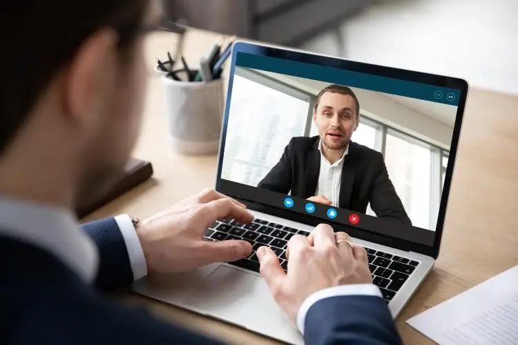 A Human Resource Manager Interviews a Job Candidate in an Online Meeting. (1)