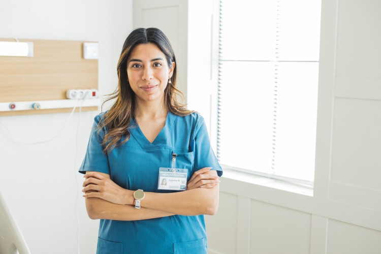 A smiling nurse in a medical clinic.