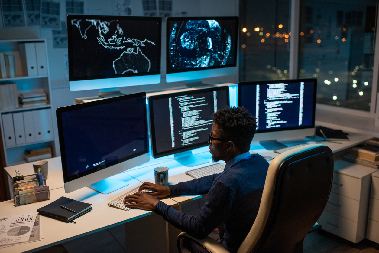 An It Security Specialist Works at a Computer in a Ready Room.