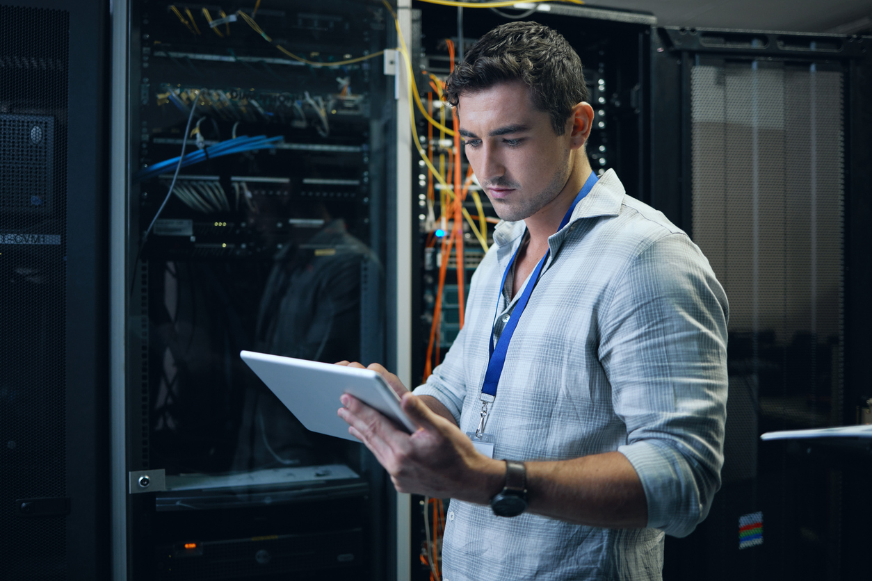 Systems Engineer Working on a Tablet.