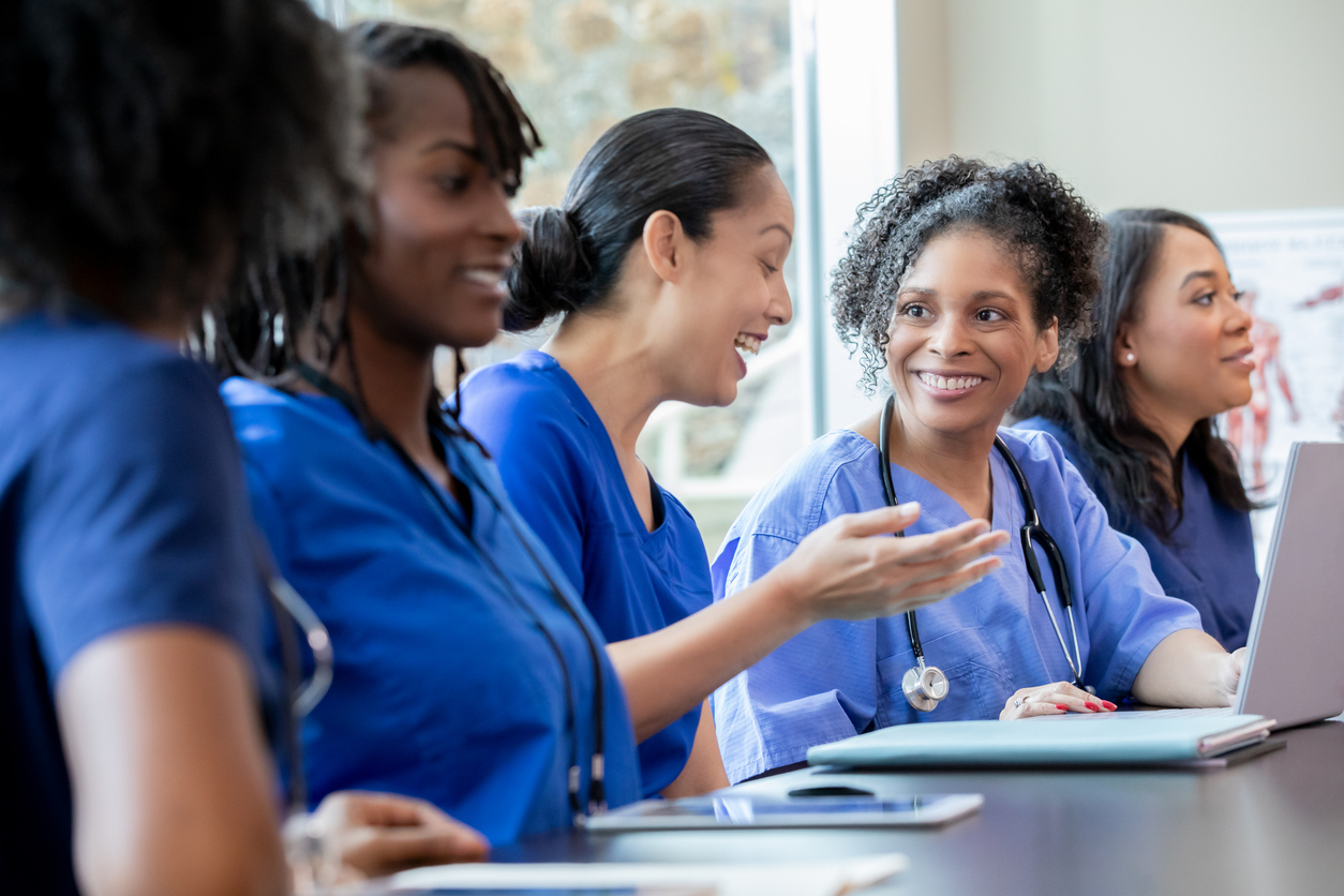 A group of smiling nurses.