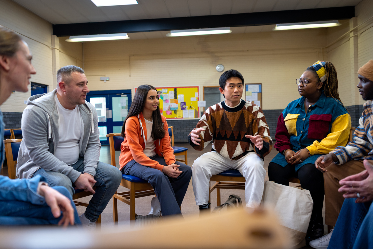 A Community Health Worker Meets With a Group of Community Members.